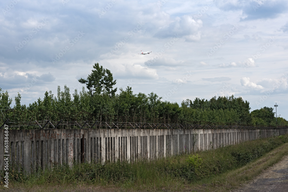 The old concrete fence at the runway 18 west of frankfurt airport