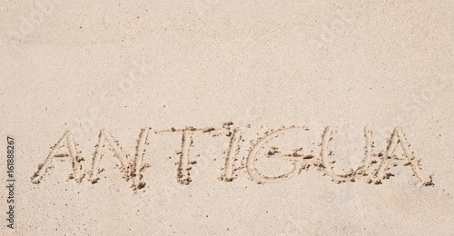 Antigua written on a sandy beach.