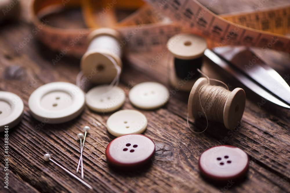 Sewing accessories on wooden background Sewing accessories on wooden background