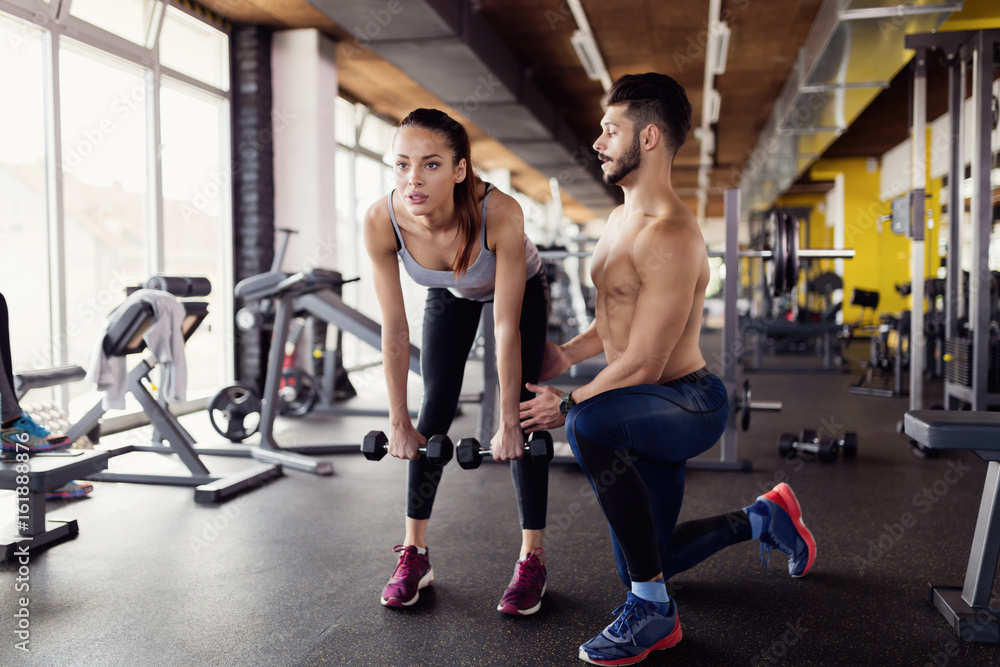 Young attractive woman doing exercises in gym Young attractive woman doing exercises in gym