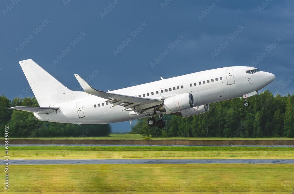 Airplane takes off from the runway at the airport, the kind of steering track lights.