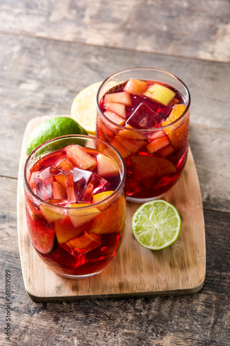Sangria drink in glass on wooden table
