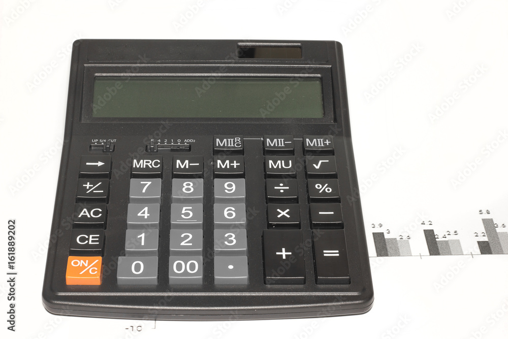 Calculator and document on the white background. Calculator and document on the white background.