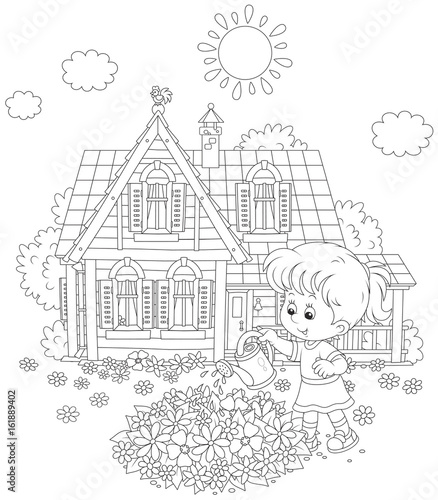 Little girl watering flowers on a flowerbed in front of her house