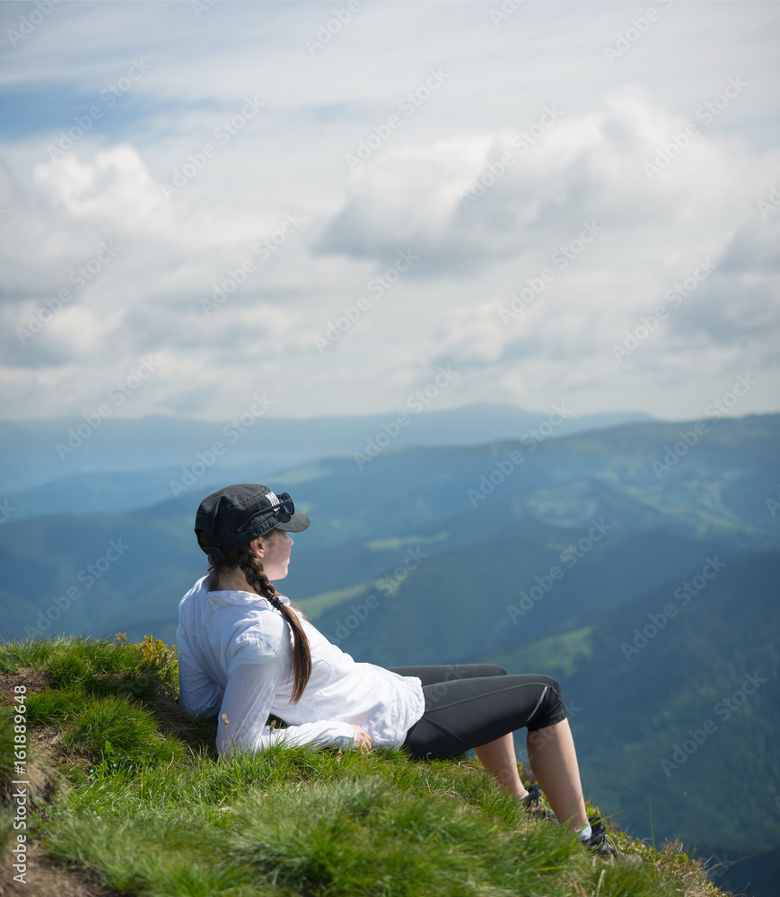 Tourist relax on the mountain top. Sport and active life concept