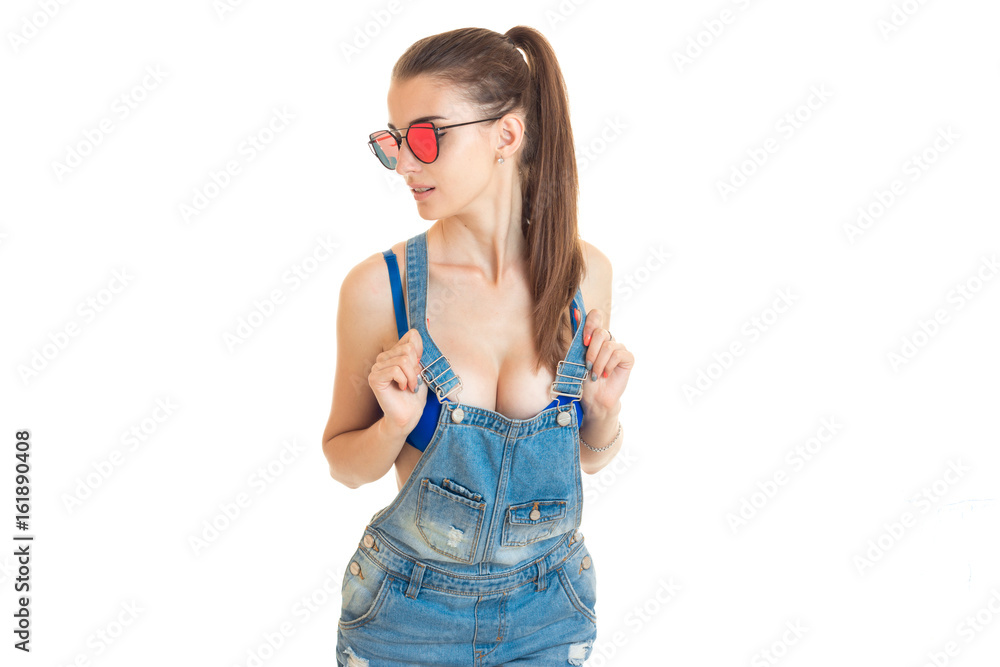 tæppe At regere Oh Sexy girl in denim overalls and blue bra with big silicon breasts Stock  Photo | Adobe Stock