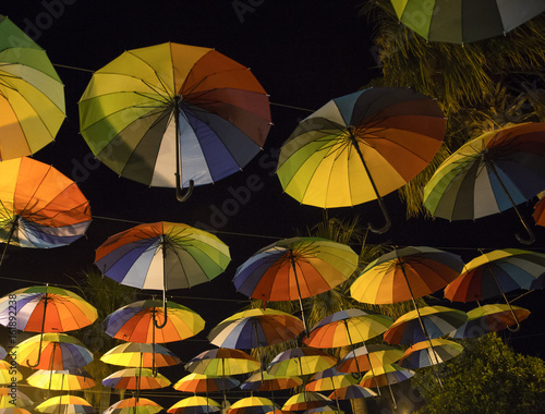 Rainbow umbrellas in a dark