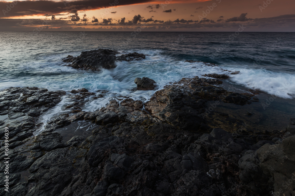 Sunset along the Queens Bath area of Kauai, Hawaii