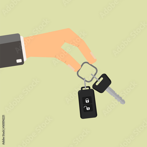 Hand holding car key. Buying or rent car.