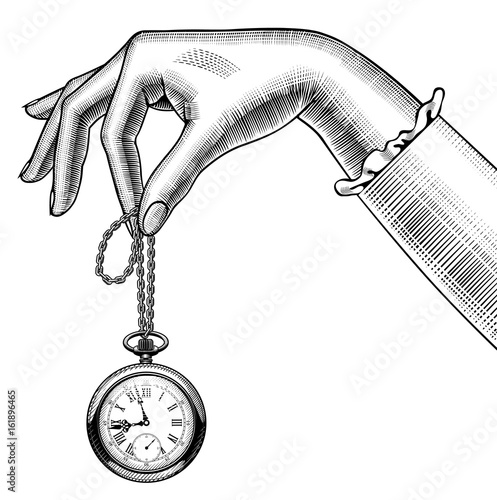 Woman's hand with a retro pocket watch