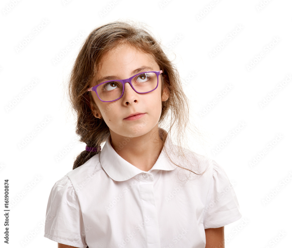Thoughtful girl in glasses