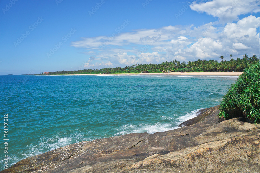 Indian Ocean surface summer wave background. Exotic water landscape with clouds on horizon. tropical water paradise. Maldives nature relax. Travel island resort. Untouched beach in Sri Lanka