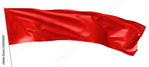 Long red flag on flagpole flying in wind