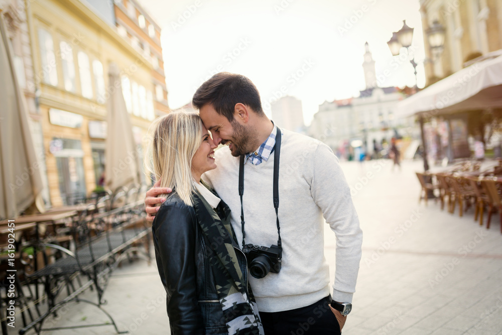 Fototapeta premium Tourist couple enjoying sightseeing and exploring city