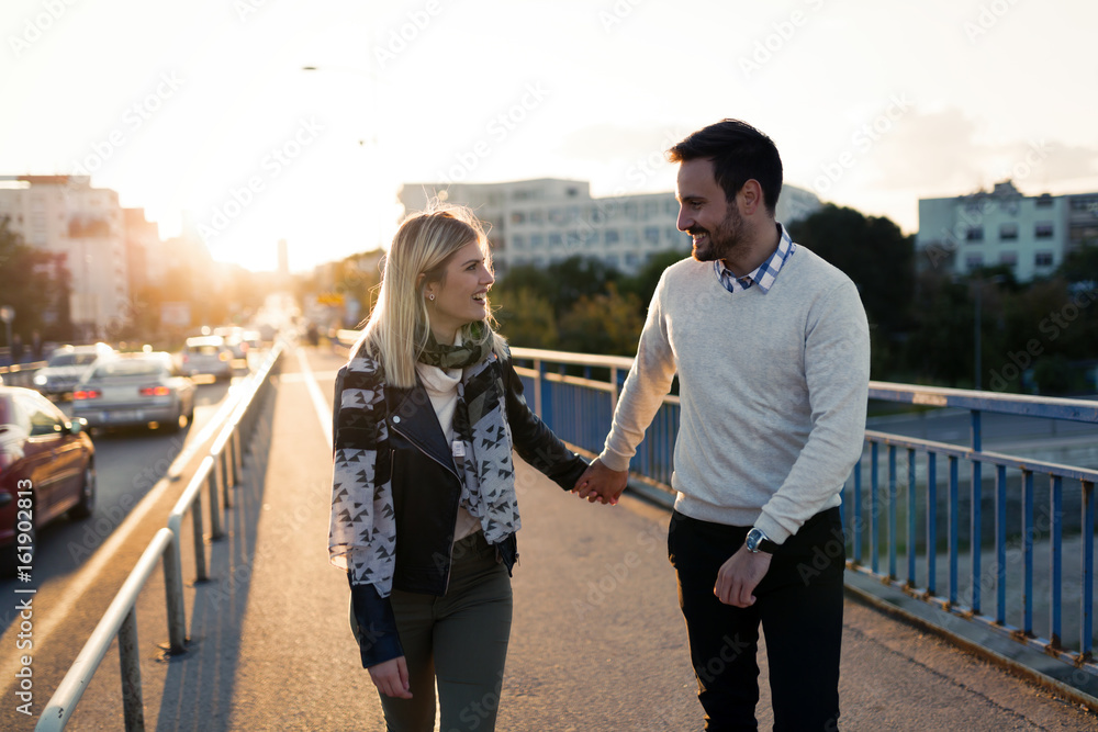 Happy young attractive couple spending time together - obrazy, fototapety, plakaty 