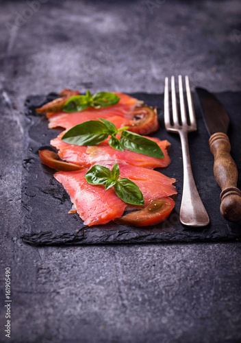 Salmon carpaccio with basil and tomato