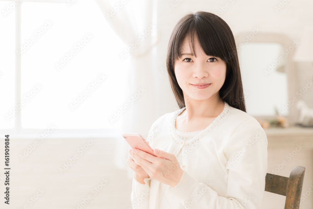attractive asian woman using smart phone attractive asian woman using smart phone