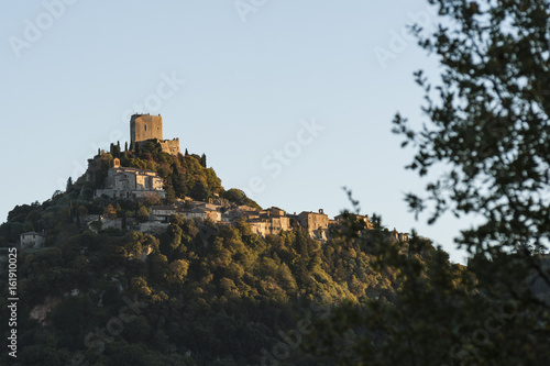 The Fortress of Tentennano above the orchard in a small hamlet in Castiglione d’Orcia - Rocca d'Orcia, seen from Bagno Vignoni, Tuscany, Italy