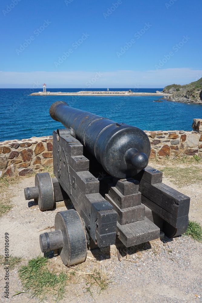 Old canon on the coast in the harbor of Port-Vendres, Mediterrean sea, Cote Vermeille, Roussillon, Pyrenees Orientales, south of France