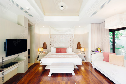 Luxury bedroom hotel interior  TV  sofa  wooden floor