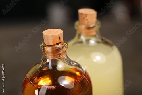 Two bottles of alcoholic drink. Close up