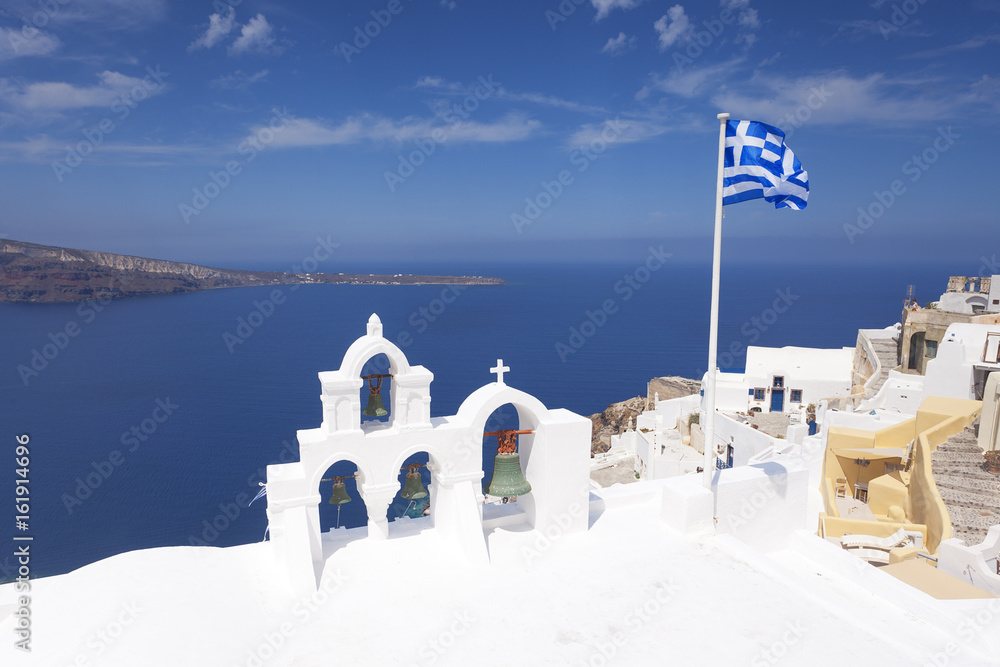 Church bells and Greek flag in Santorini 