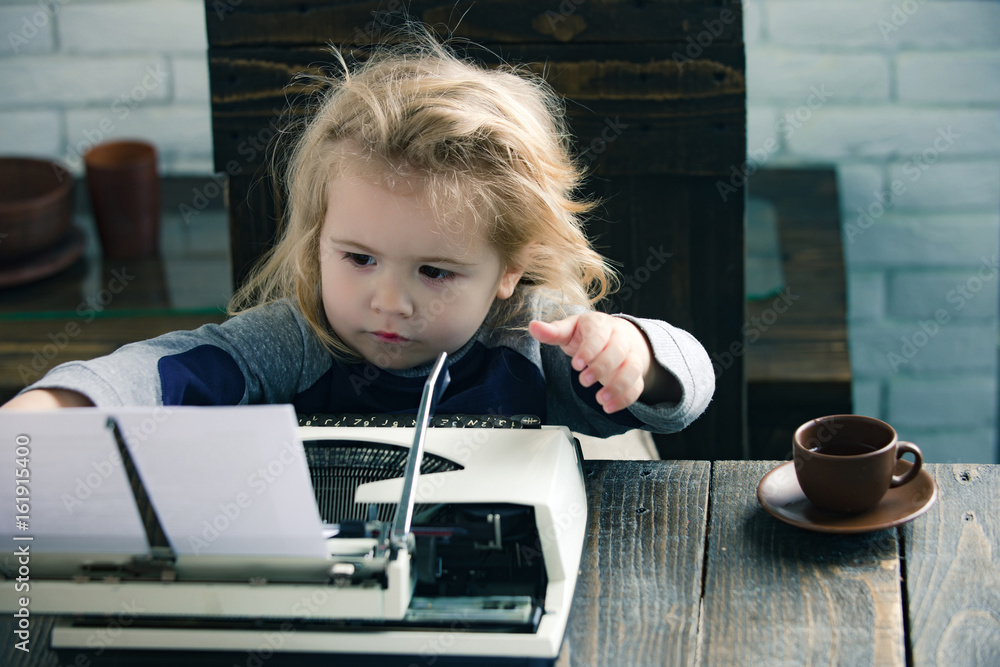 small boy or businessman child with typewriter
