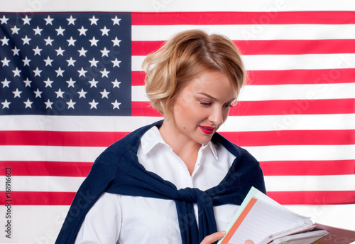 Student is learning English as a foreign language on American flag  background photo