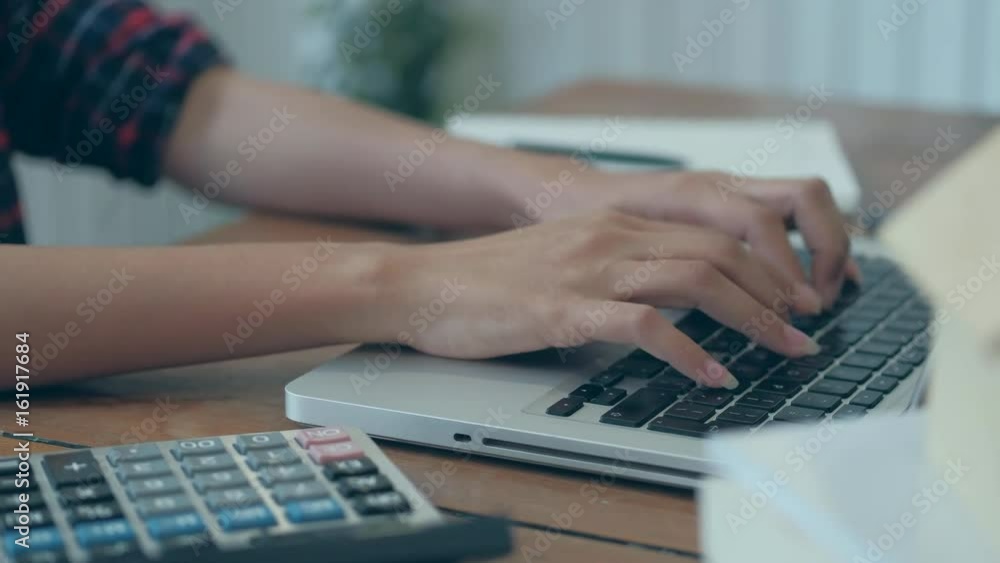 A business woman working on the laptop at the office, Looking for direction and inspiration, Office desk table with computer, supplies, Copy space for text A business woman working on the laptop at the office, Looking for direction and inspiration, Office desk table with computer, supplies, Copy space for text