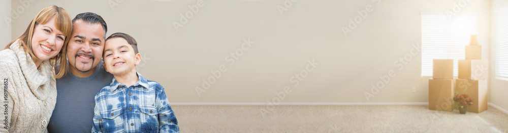 Mixed Race Family In Empty Room With Moving Boxes Banner. Mixed Race Family In Empty Room With Moving Boxes Banner.