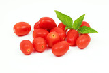 Cherry tomatoes with basil leaf on a white background
