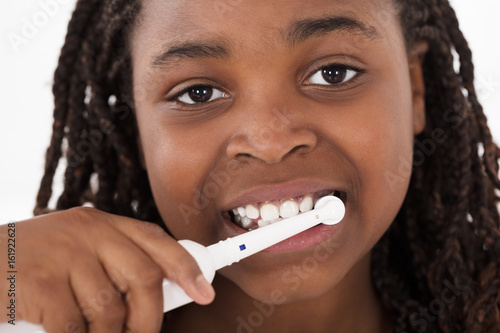African Girl Brushing Her Teeth