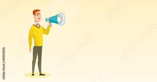 Young man speaking into megaphone.