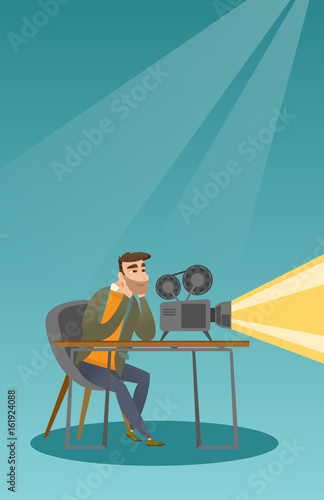 Caucasian projectionist showing a new film.