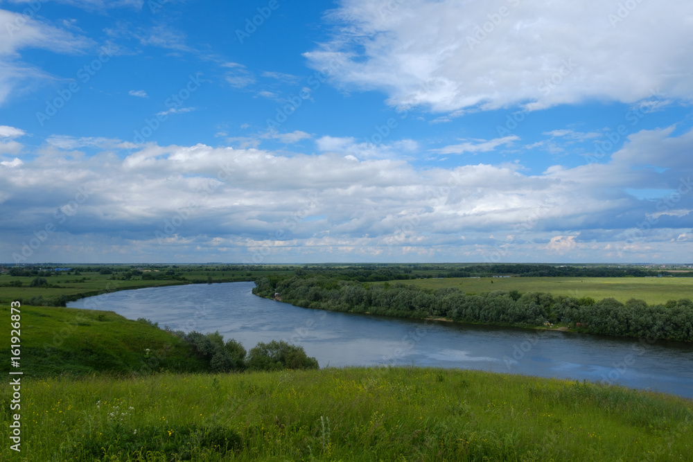 Summer landscape with views of the river from the high Bank