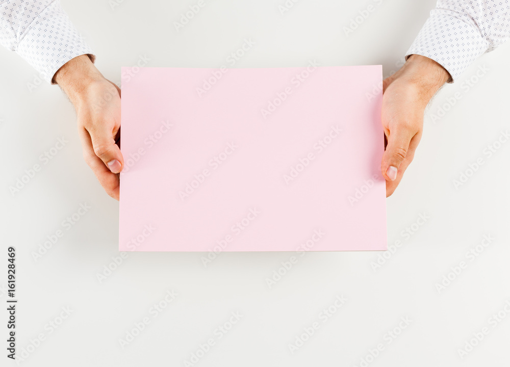 Hand holding blank opened book mock up Hand holding blank opened book mock up