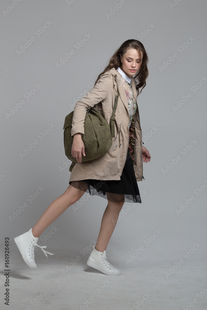 young girl in the studio isolated on gray young girl in the studio isolated on gray