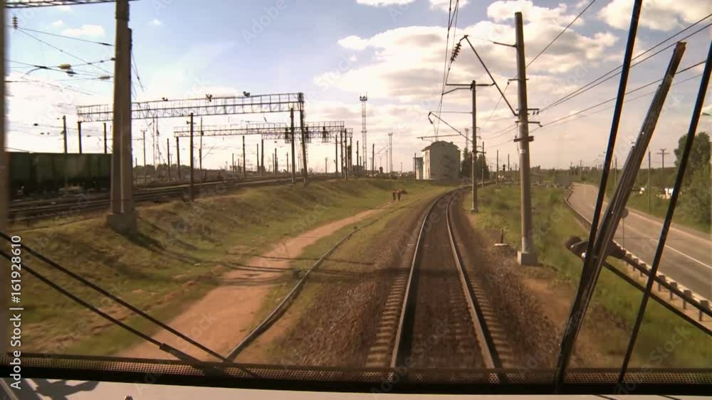 Timelapse. Video from the train cab. Railway Express going out of town . Timelapse. Video from the train cab. Railway Express going out of town .