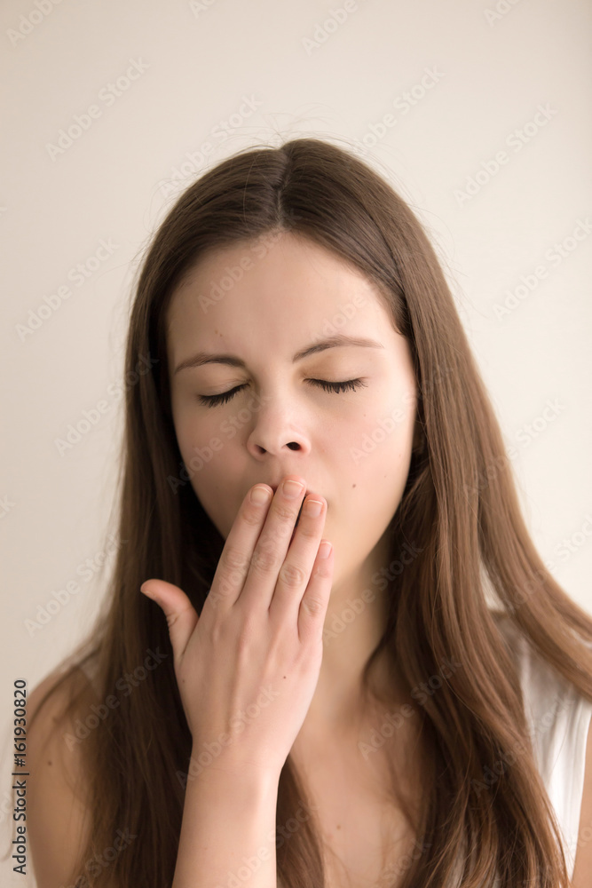 Headshot portrait of sleepy young woman. Tired pretty teen girl yawning with closed eyes. Adorable female feeling lack of sleep, boring during the day, struggling with drowsiness. Close up. Front view Headshot portrait of sleepy young woman. Tired pretty teen girl yawning with closed eyes. Adorable female feeling lack of sleep, boring during the day, struggling with drowsiness. Close up. Front view