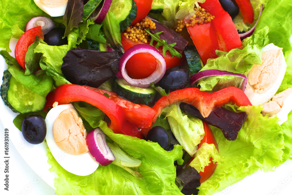 salad from fresh vegetables in a plate on a table, selective focus salad from fresh vegetables in a plate on a table, selective focus