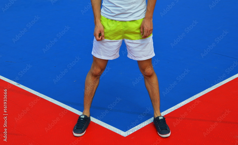 Young man on the colorful surface Young man on the colorful surface