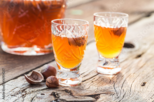 Homemade sweet liqueur with alcohol and hazelnuts