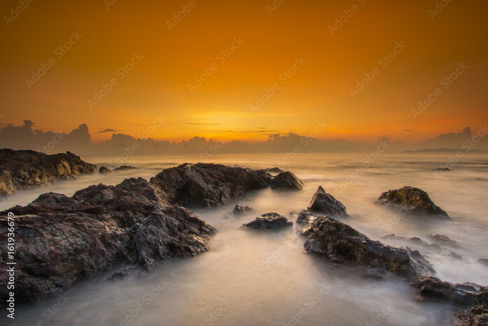Long exposure shot of beautiful sunrise located at Pantai Pandak, Terengganu, Malaysia. Soft focus due to long exposure shot Long exposure shot of beautiful sunrise located at Pantai Pandak, Terengganu, Malaysia. Soft focus due to long exposure shot