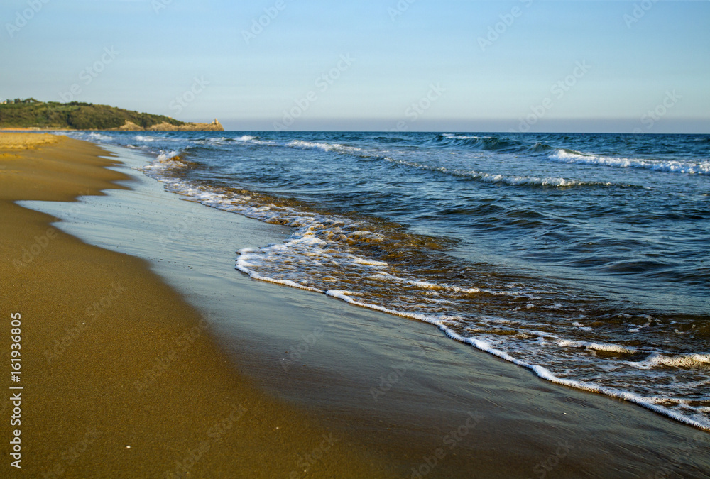 Beautiful landscape of sandy beach on the Mediterranean Sea coastline before sunset. Italy. Beautiful landscape of sandy beach on the Mediterranean Sea coastline before sunset. Italy.