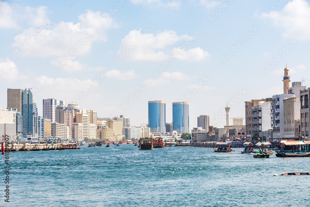 Fototapeta premium View of Dubai creek on a beautiful day, Deira district, Dubai, United Arab Emirates, UAE