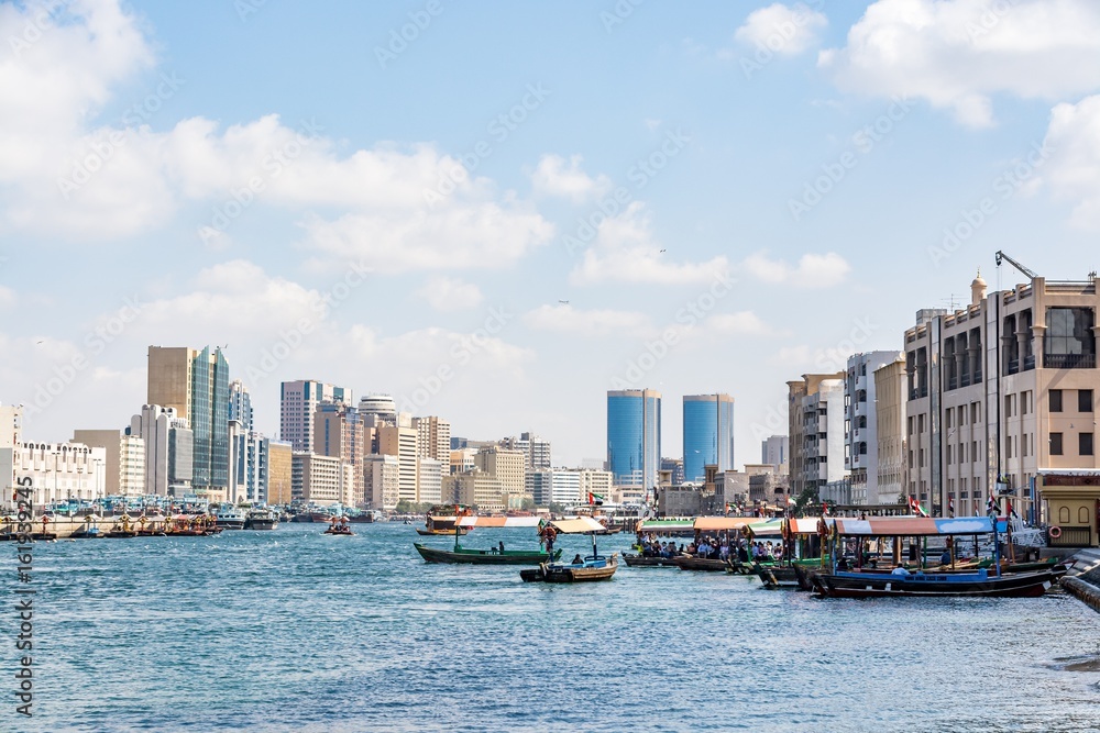 Fototapeta premium View of Dubai creek on a beautiful day, Deira district, Dubai, United Arab Emirates, UAE