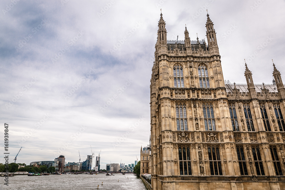 Westminster Palace (Houses of Parliament) on the side by the River Thames, London. UK