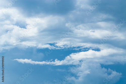 Fototapeta Naklejka Na Ścianę i Meble -  Blue sky background with tiny clouds. White fluffy clouds in the blue sky