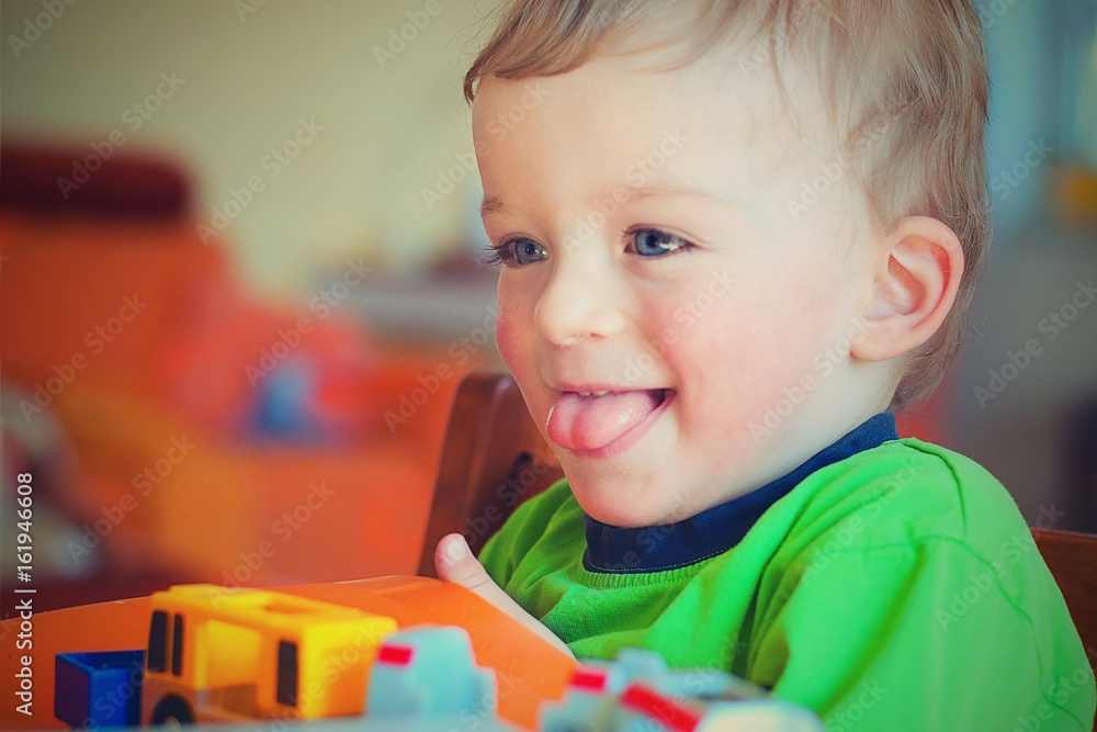 Happy boy sticking his tongue out. Child concept. Happy boy sticking his tongue out. Child concept.