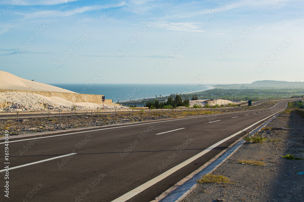 National Road with white sand dune in Mui Ne National Road with white sand dune in Mui Ne